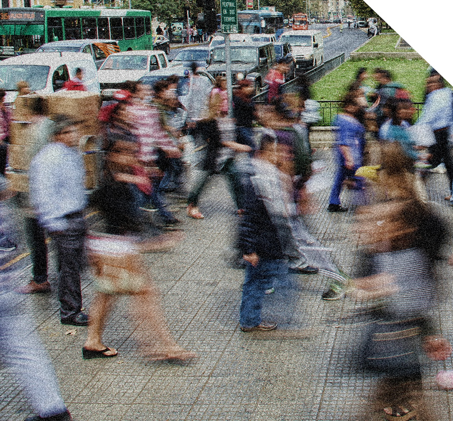 A blurred image of people walking on a street