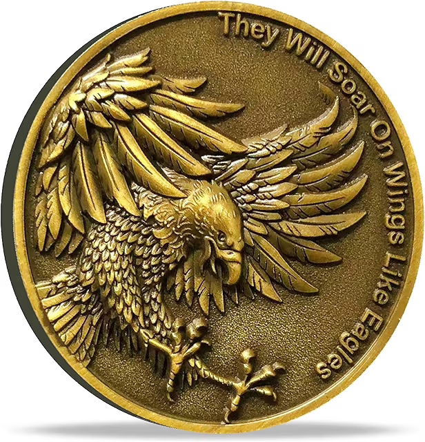 Gold Coin Eagle Gold coin with textured print of a picture of an eagle, and the words, "They will soar on wings like eagles."